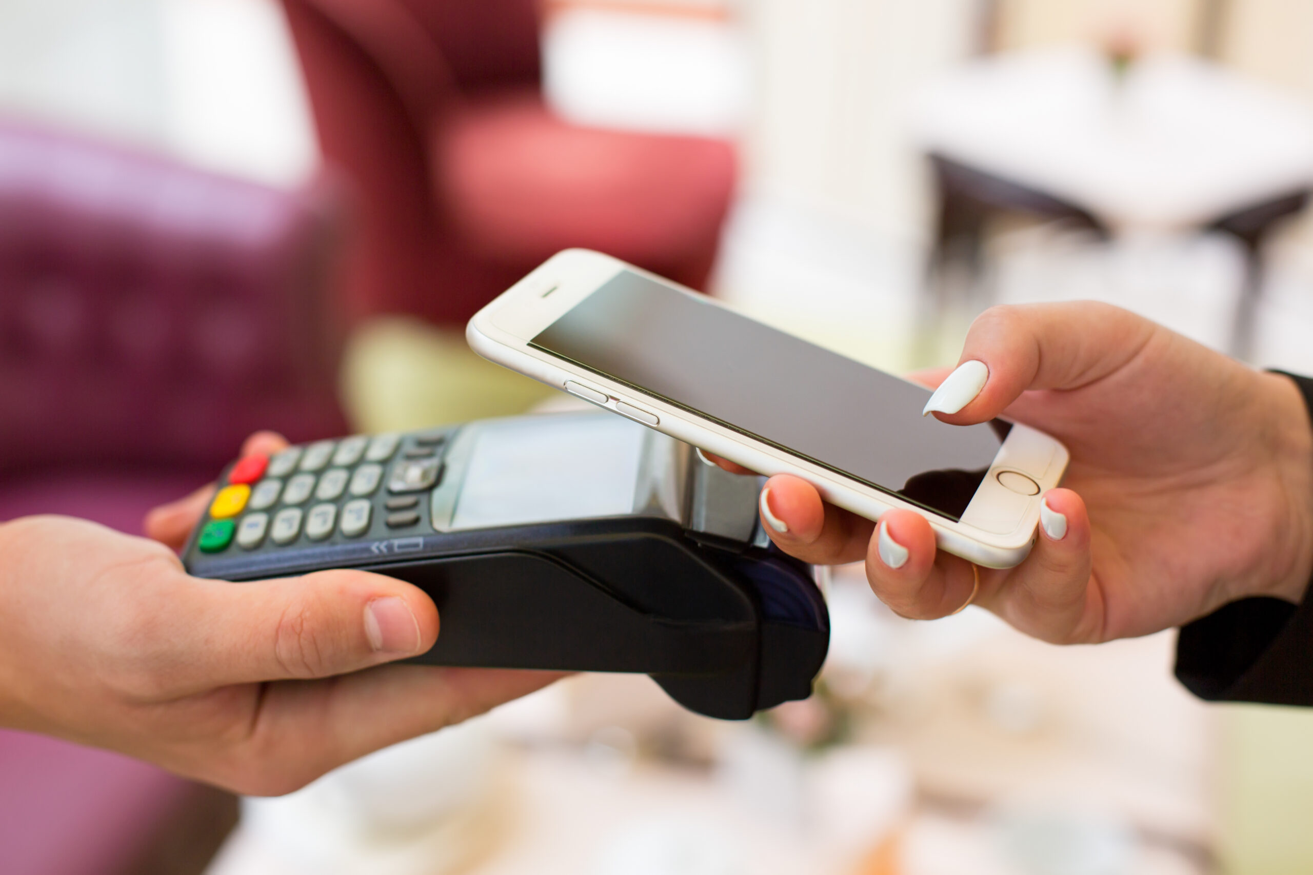 Woman using mobile wallet inside a store.